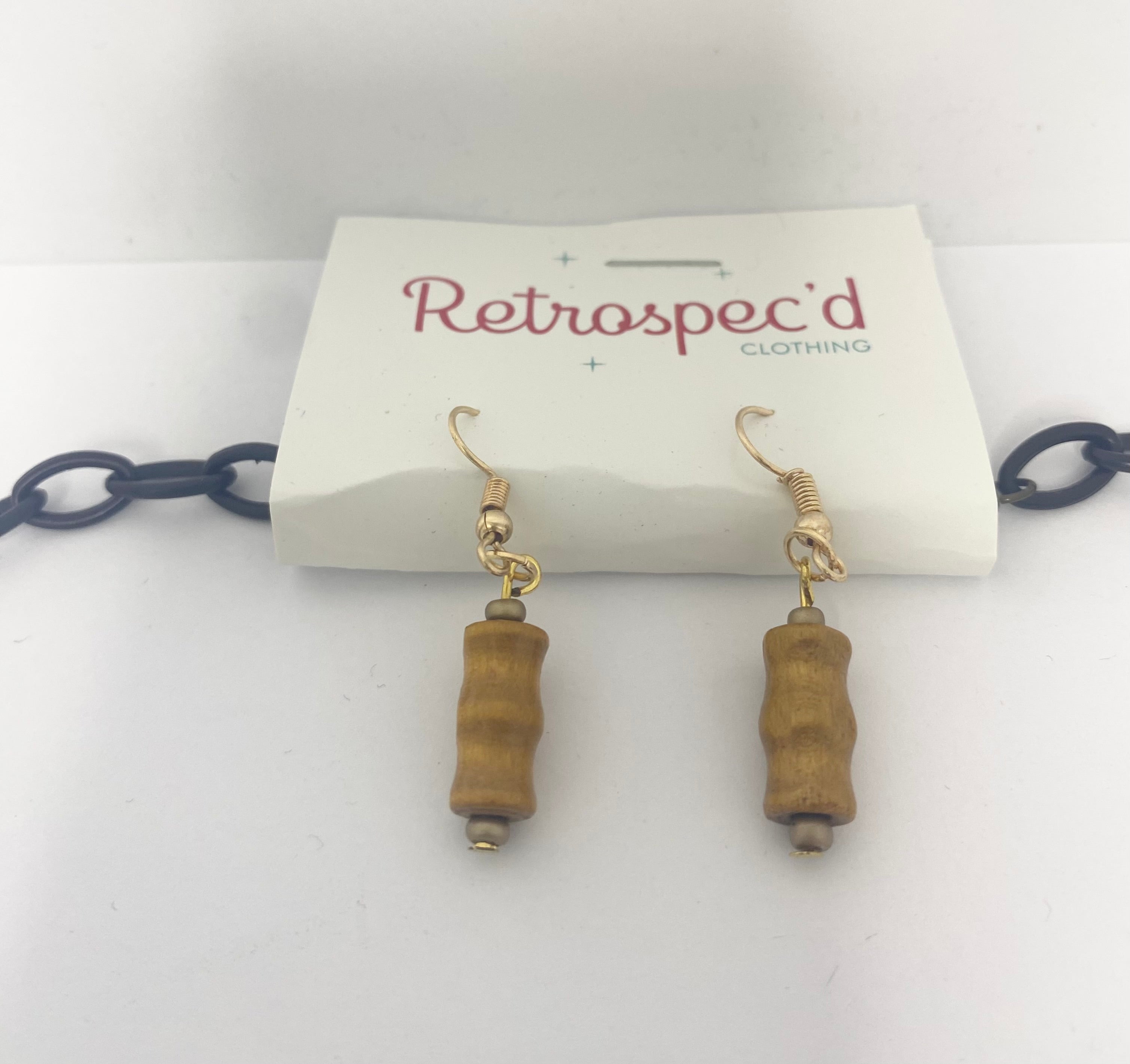 Bamboo Tiki Style Necklace Featuring Bamboo style beads with Black pendent beads on a black acrylic chain.