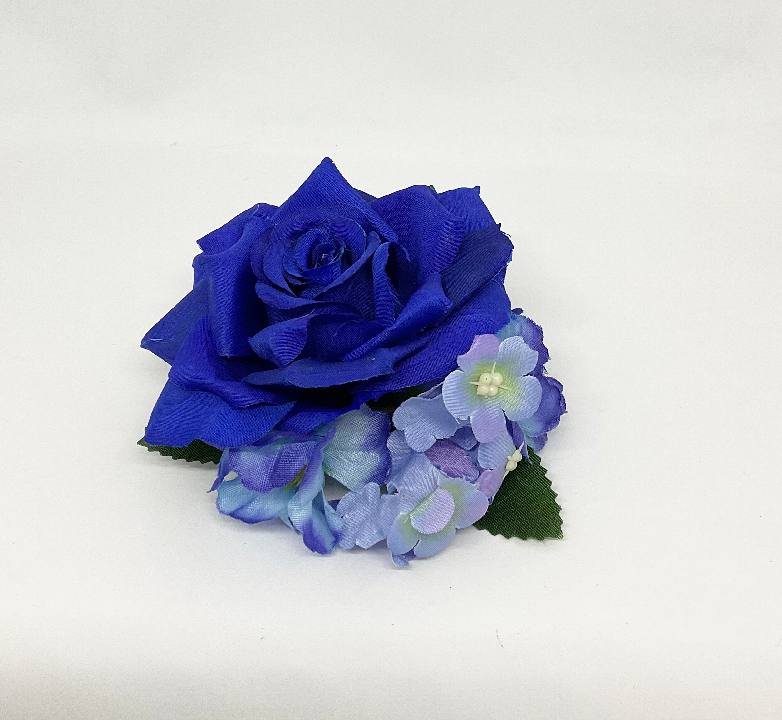 Blue fantasy rose hair flower with a green stem, accompanied by smaller purple flowers Pin-up vintage hair styling