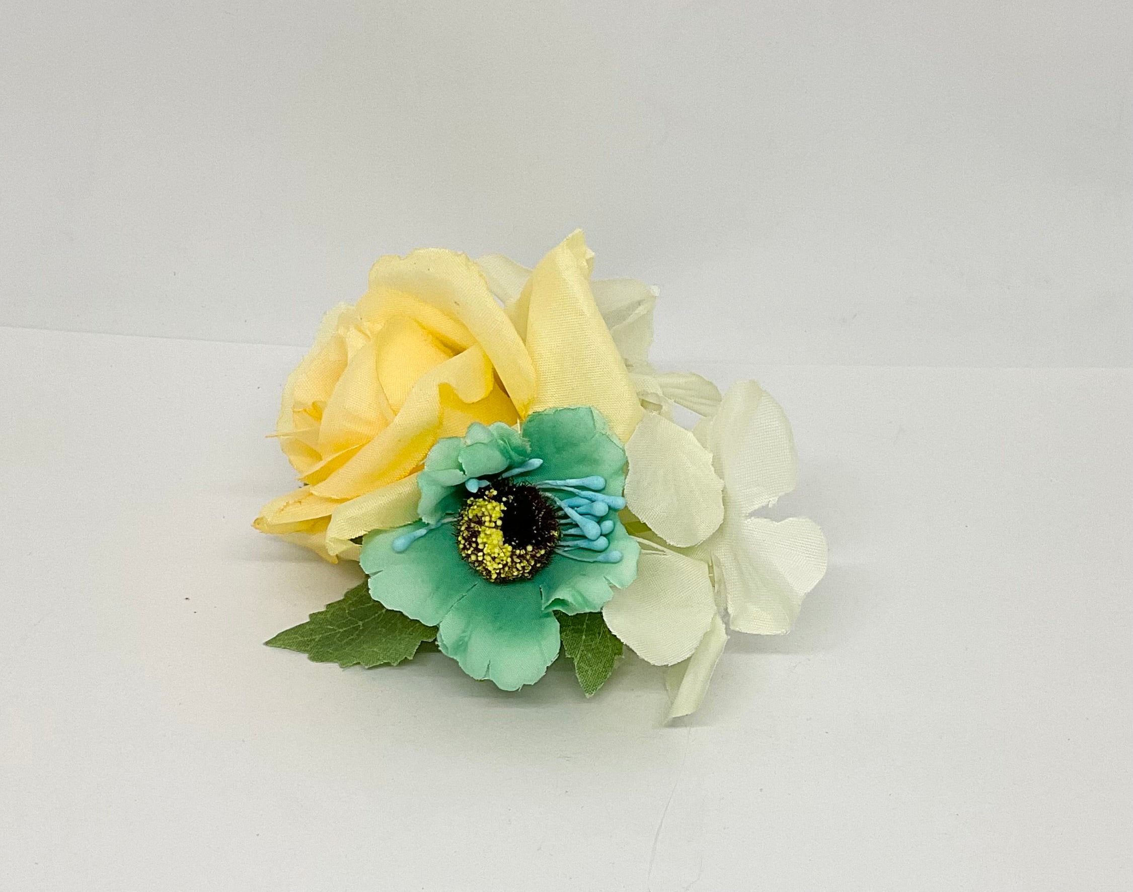 Buttercup rose with turquoise and white flowers with green leaves.pin-up vintage flowers