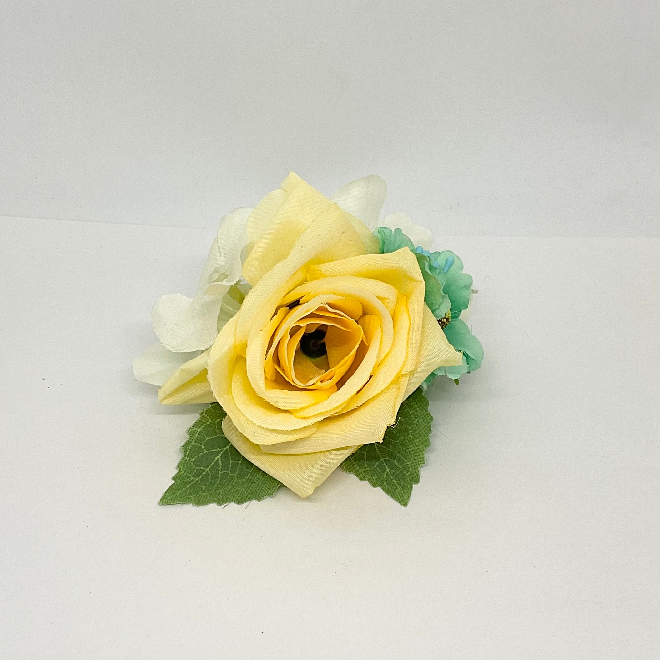 Buttercup rose with turquoise and white flowers with green leaves.pin-up vintage flowers