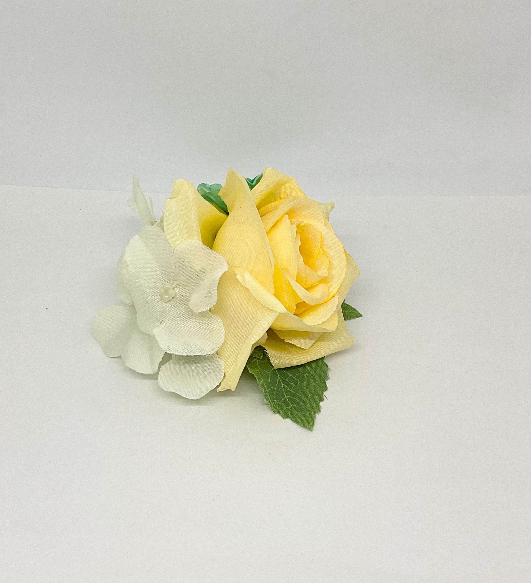 Buttercup rose with turquoise and white flowers with green leaves.pin-up vintage flowers