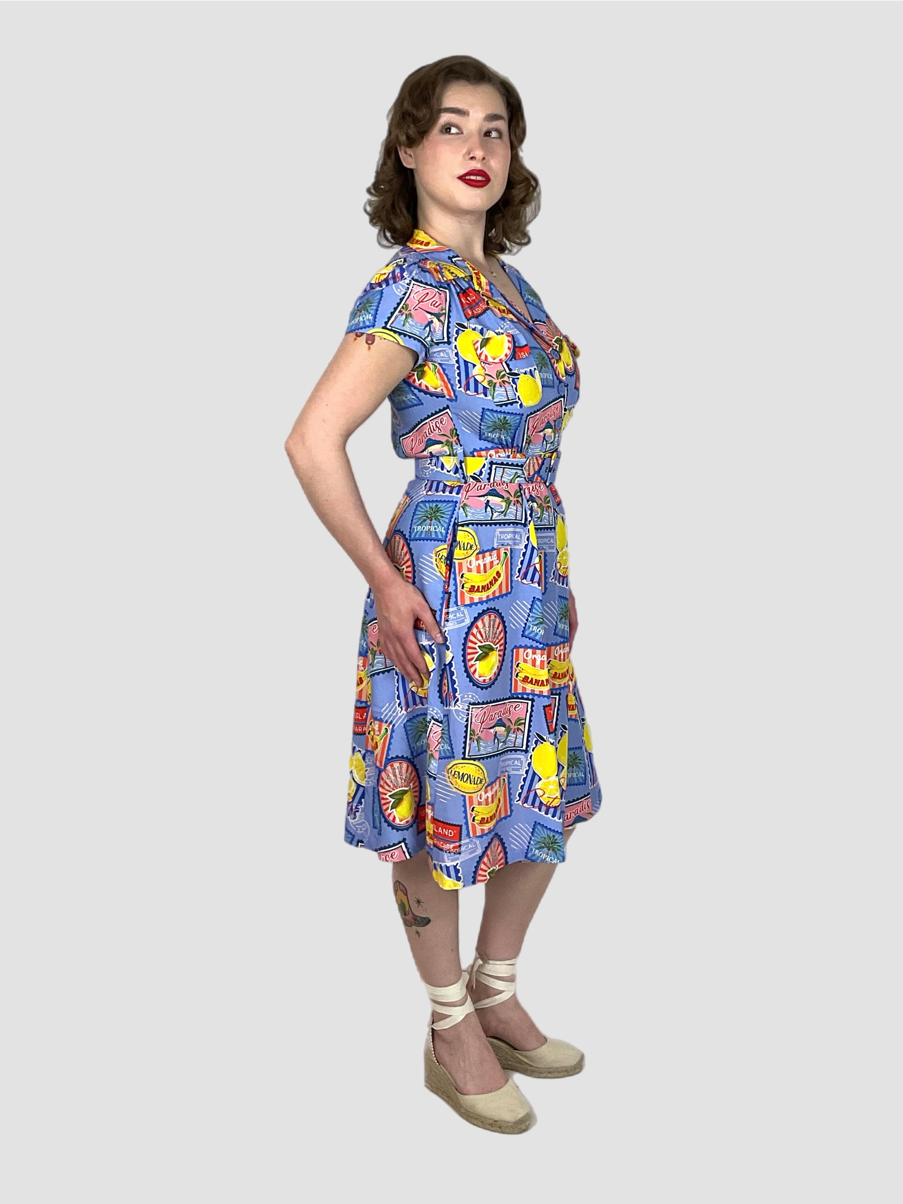 Evita Summer crush 1940s vintage style dress with blue and tropical fruity Print on rayon.