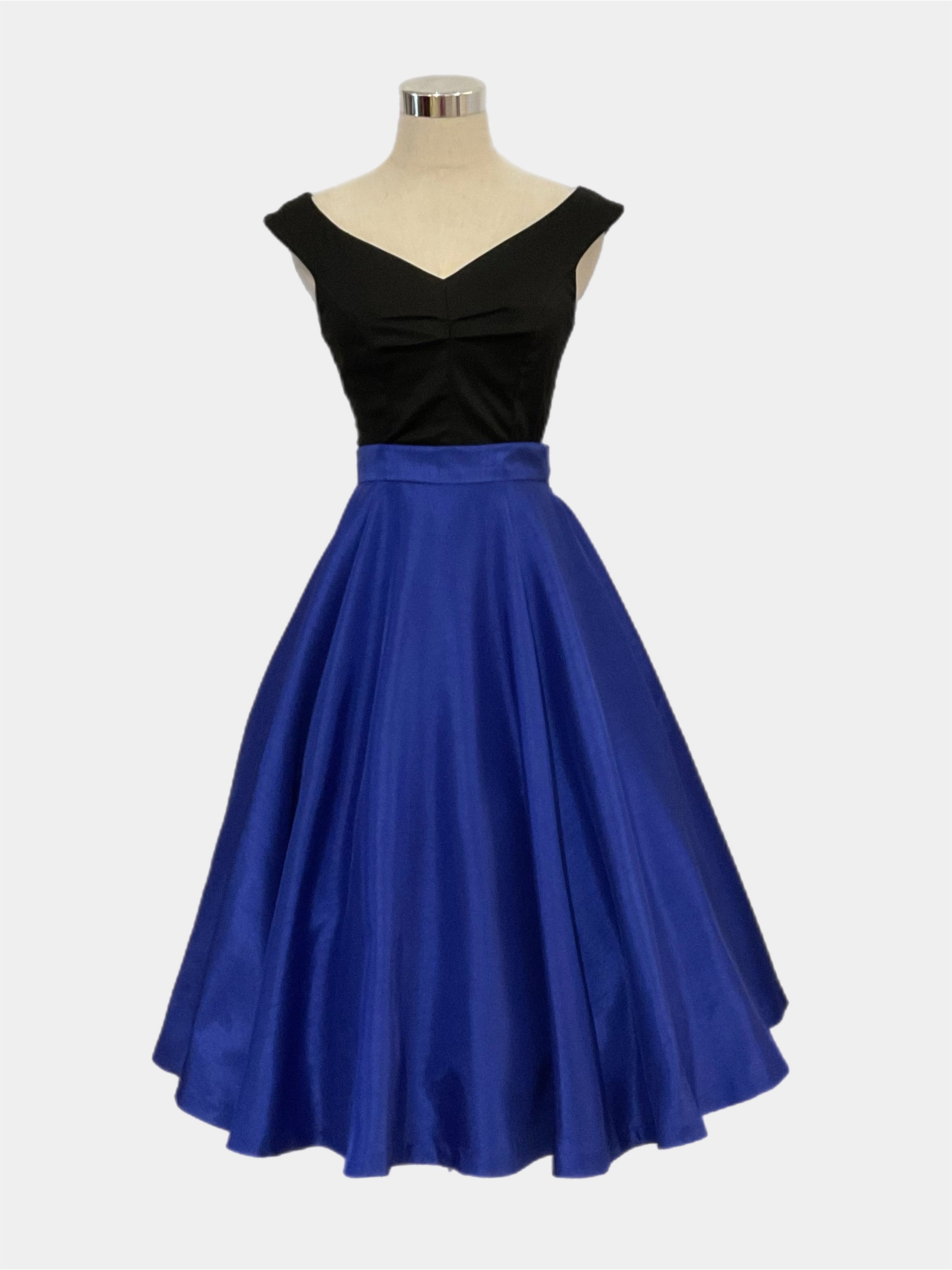 Grace kelly royal blue 1950s vintage style full circle panelled skirt with side zipper and side seam pockets, paired with black scarlet top