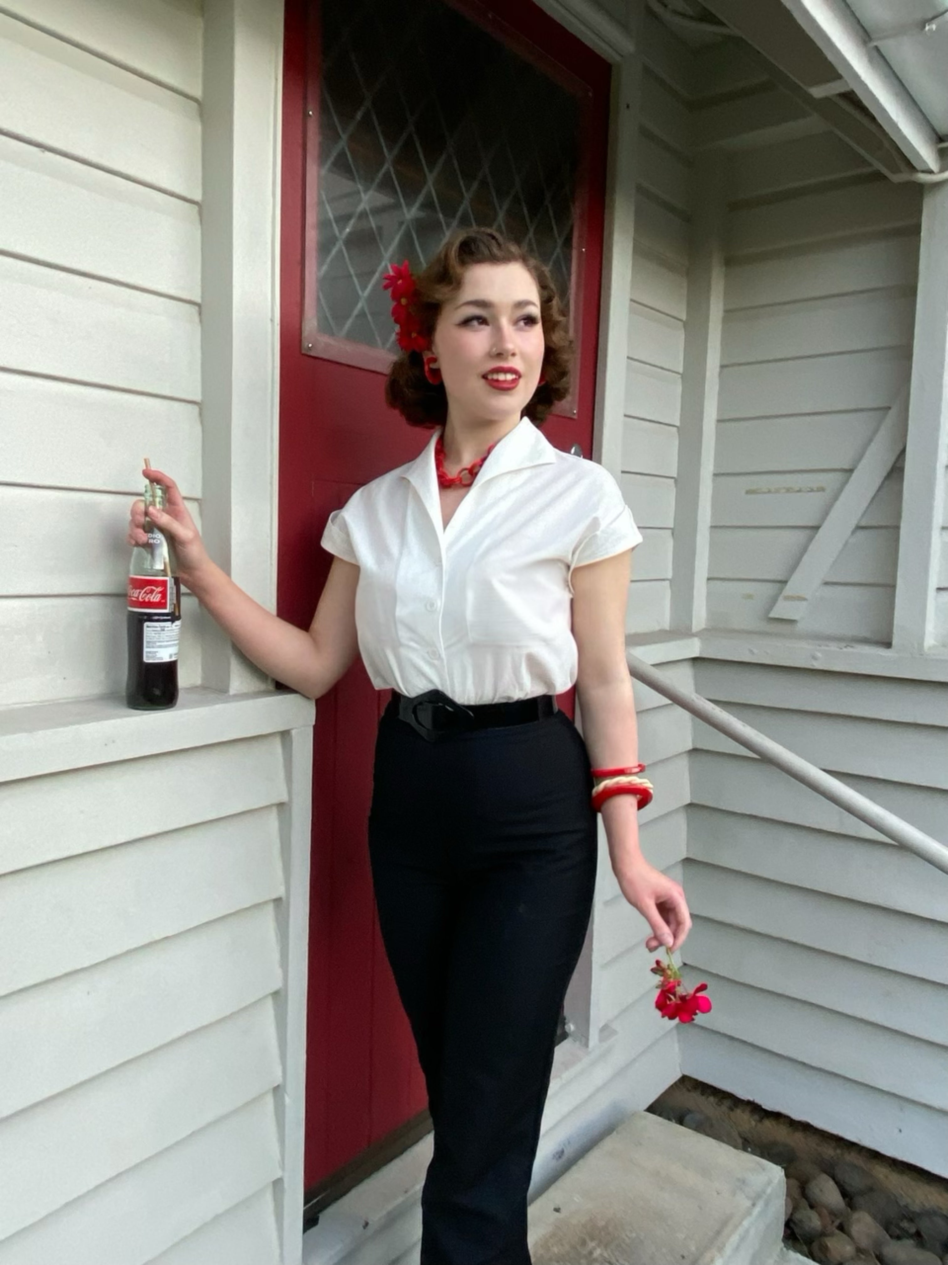 Tammy natural White vintage style cotton blouse with self covered buttons andblack cigarette pants.