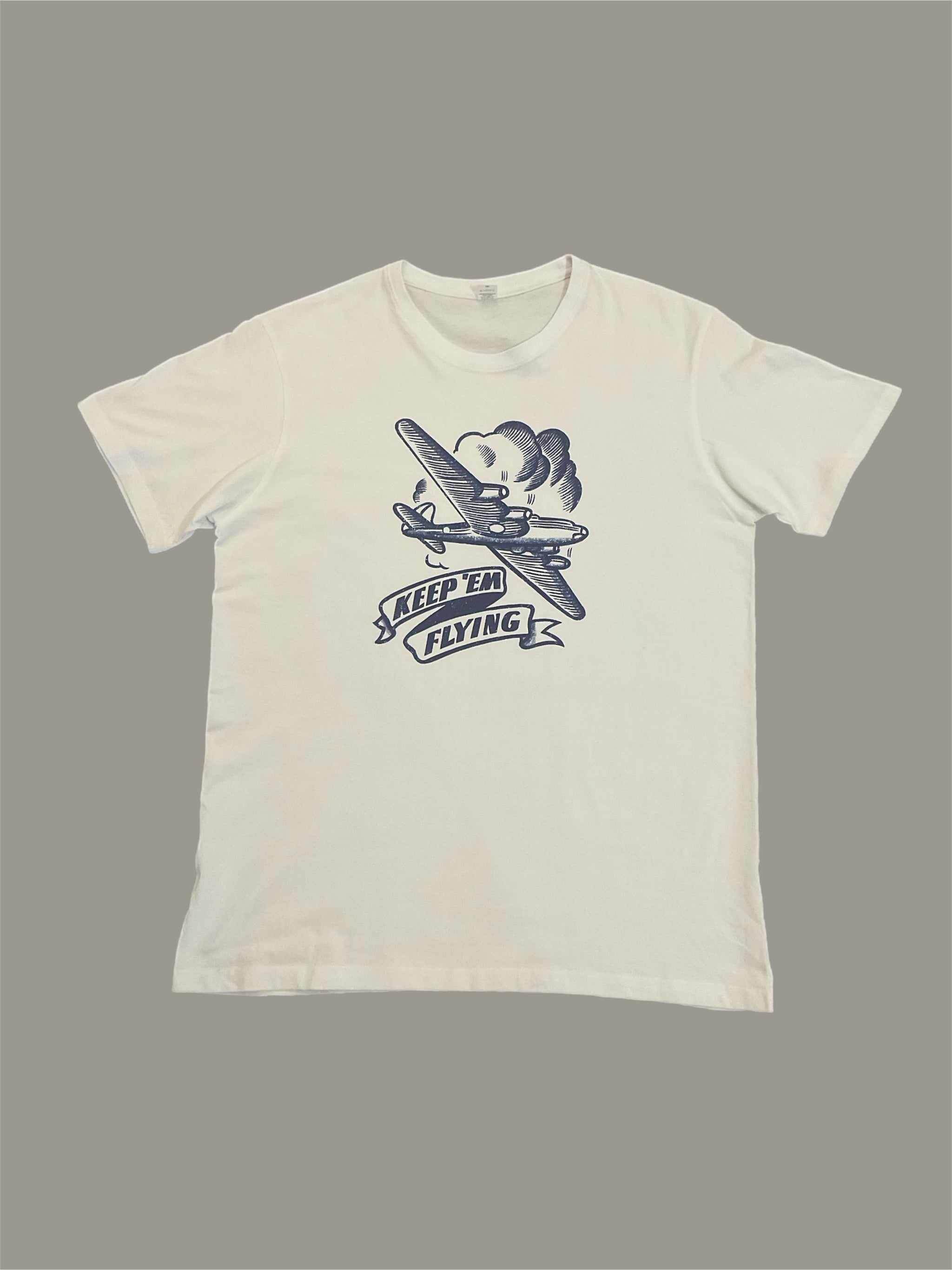 Keep,em flying mens white vintage T-shirt with a graphic print of an airplane and the text 'Keep'em Flying' on the front.