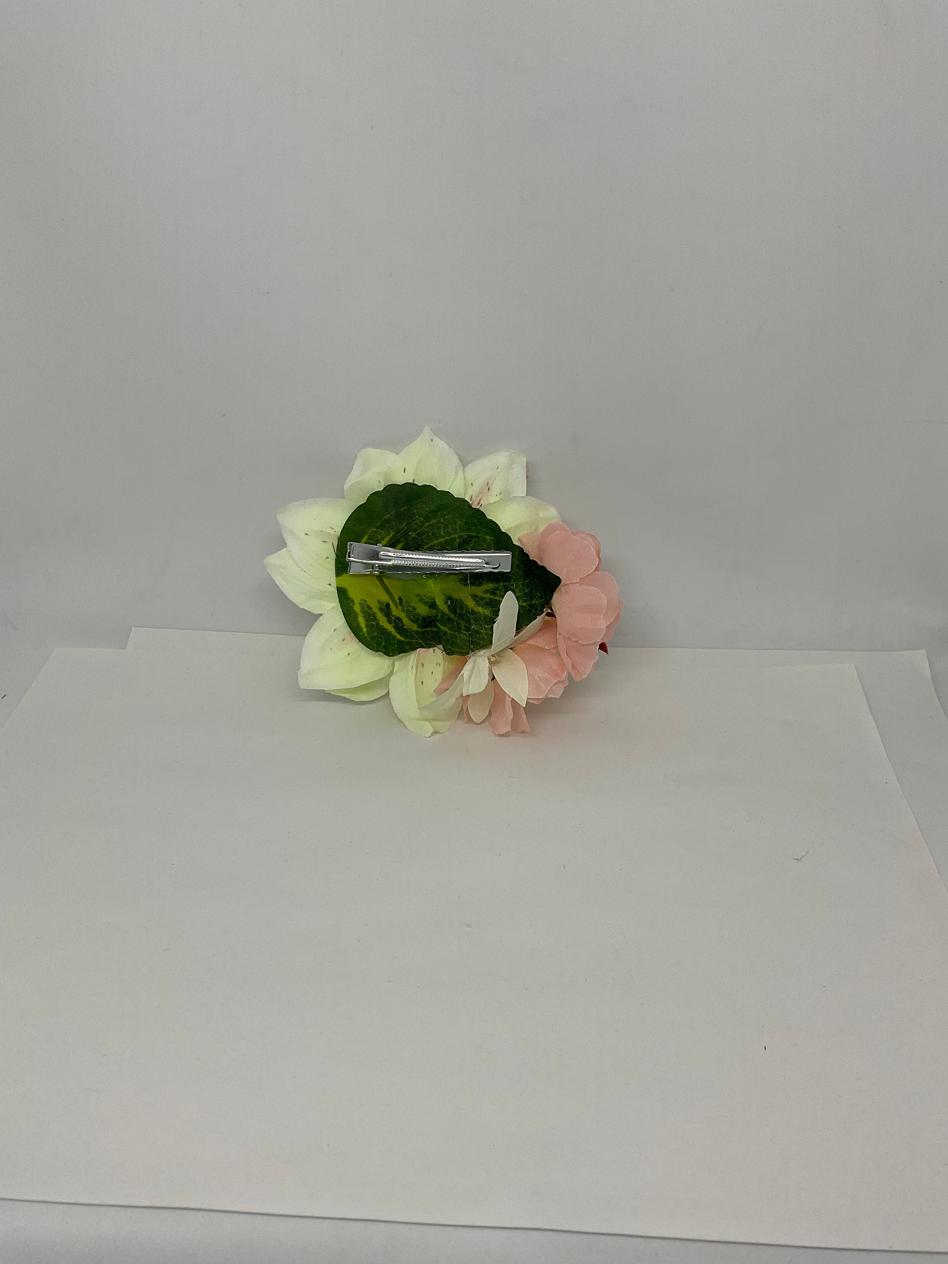 Lilly and Blossom vintage pin-up style hair flower accessory with white and pink petals, featuring a large central flower with black speckles, accompanied by smaller petals.