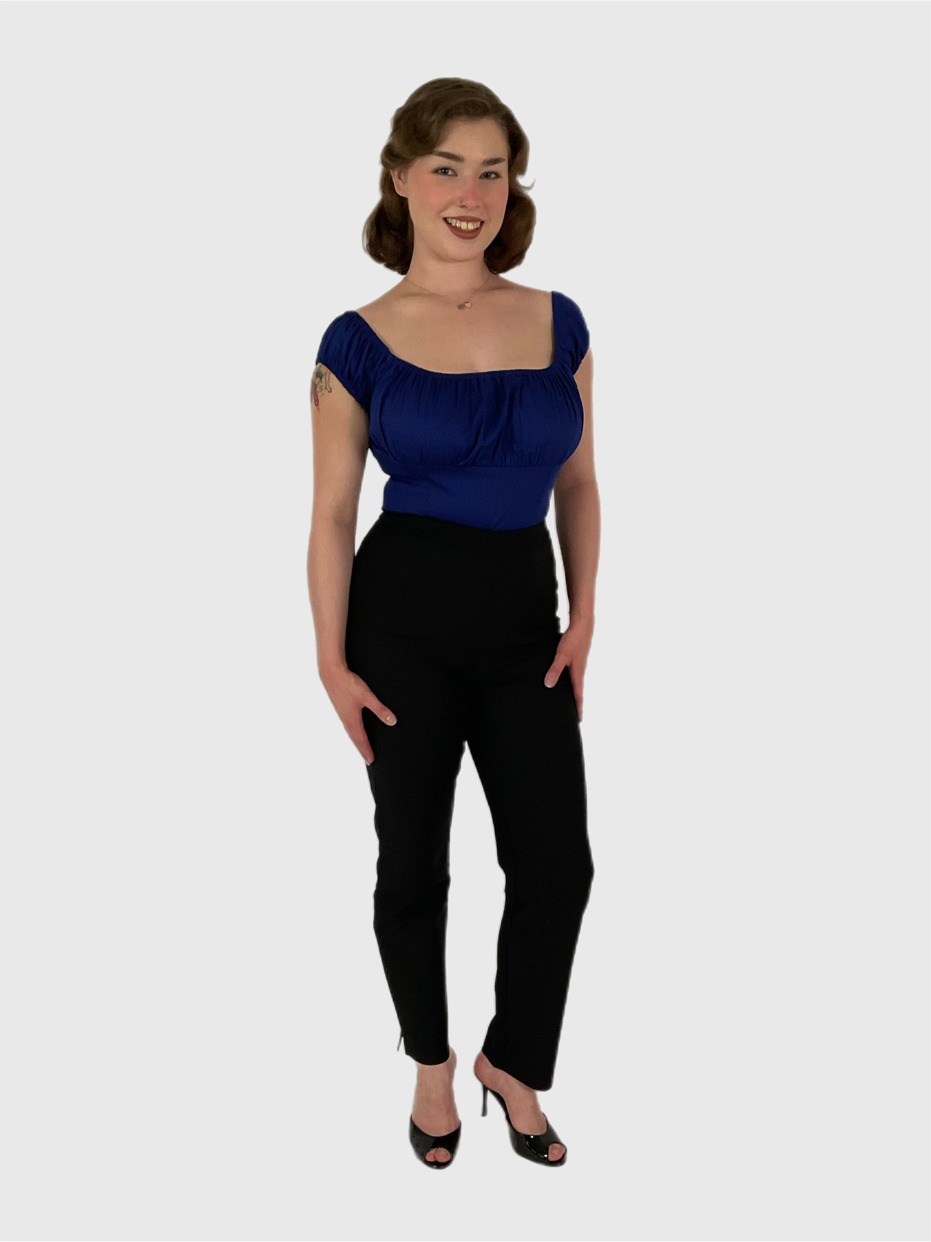 Peasant vintage style top in a dark blue with black cigarette pants. 1950s pin-up styling.