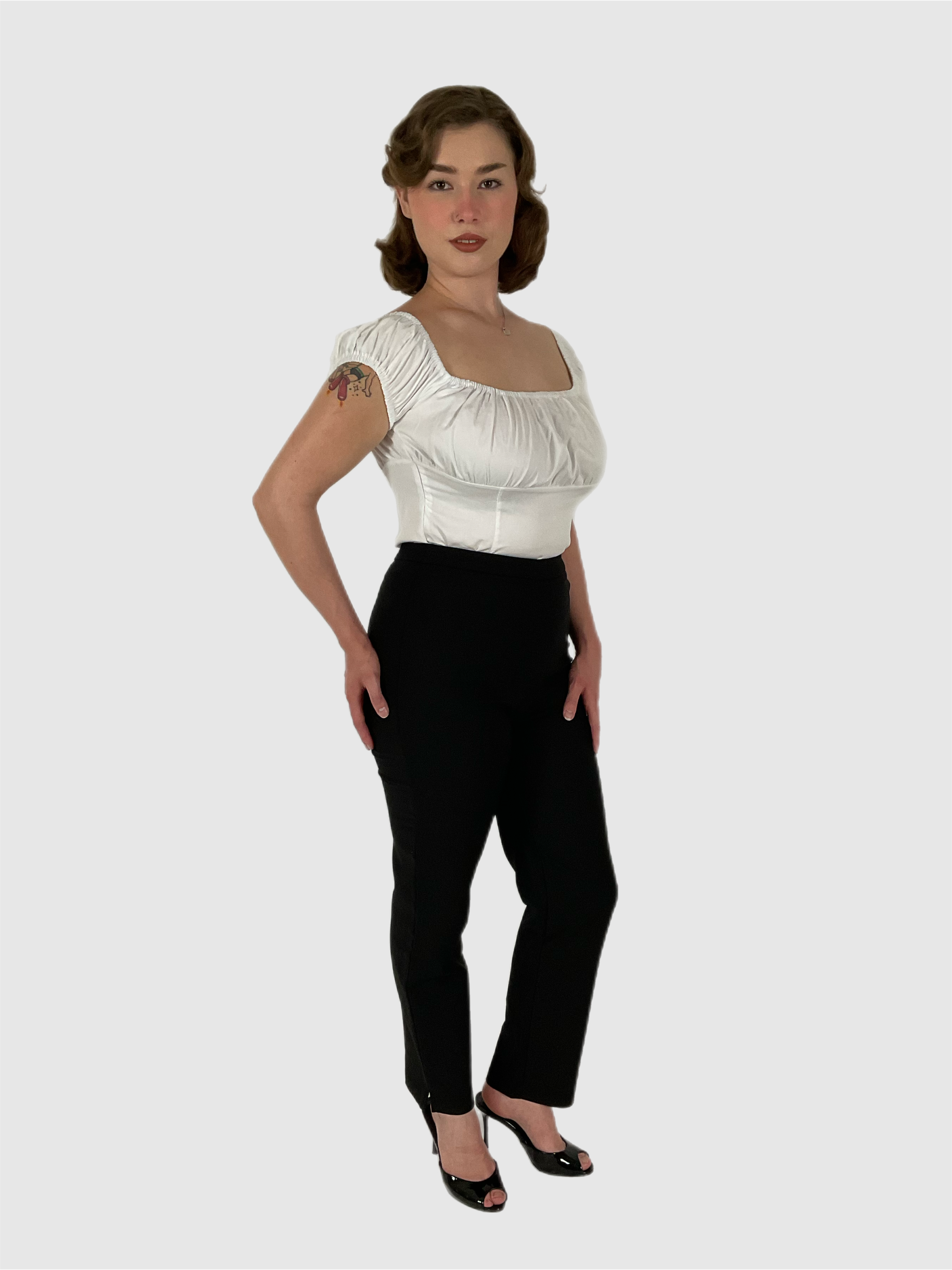 Peasant white 1950s vintage style top with black cigarette pants. Pin-up styling.