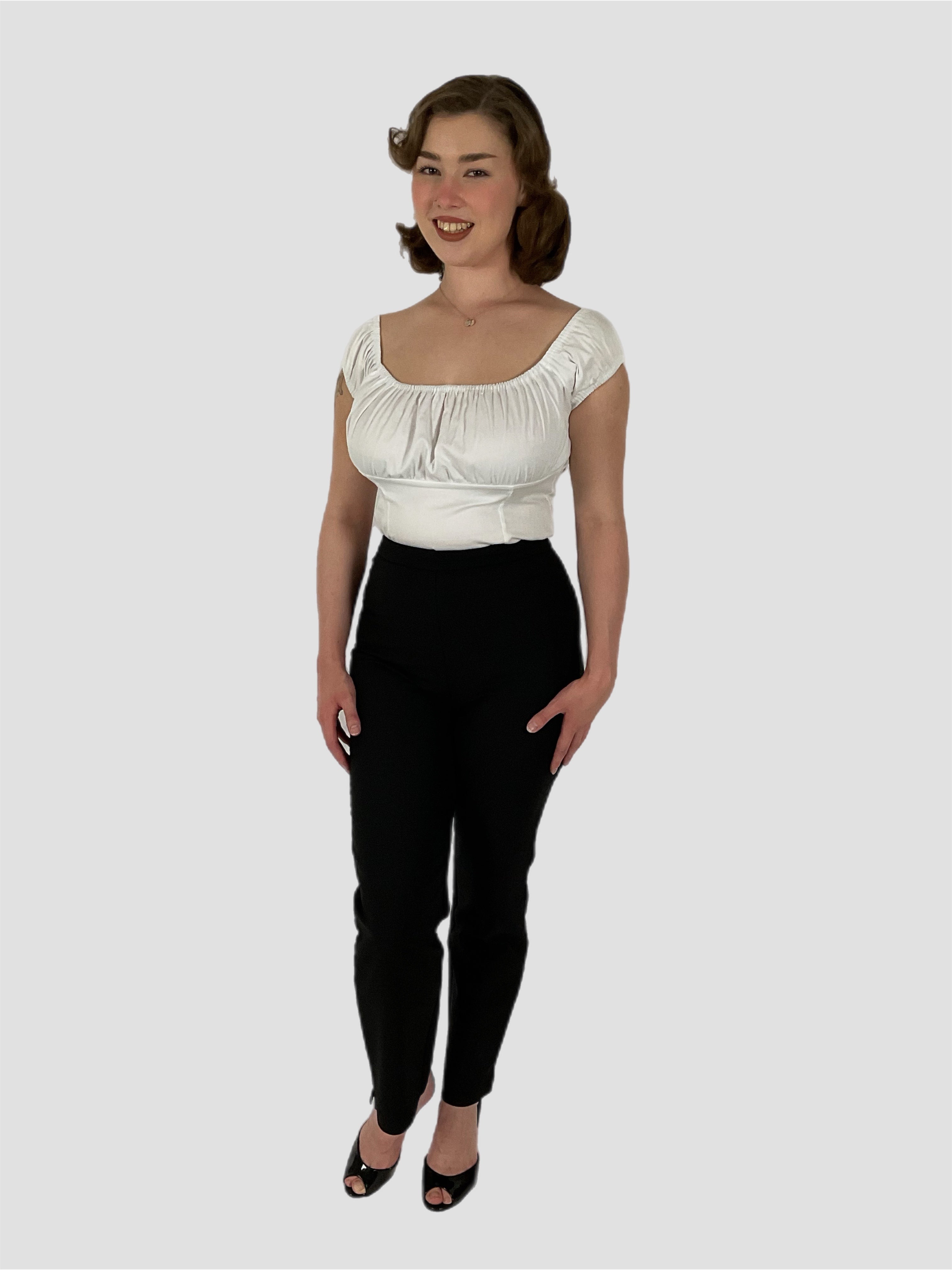 Peasant white 1950s vintage style top with black cigarette pants. Pin-up styling.
