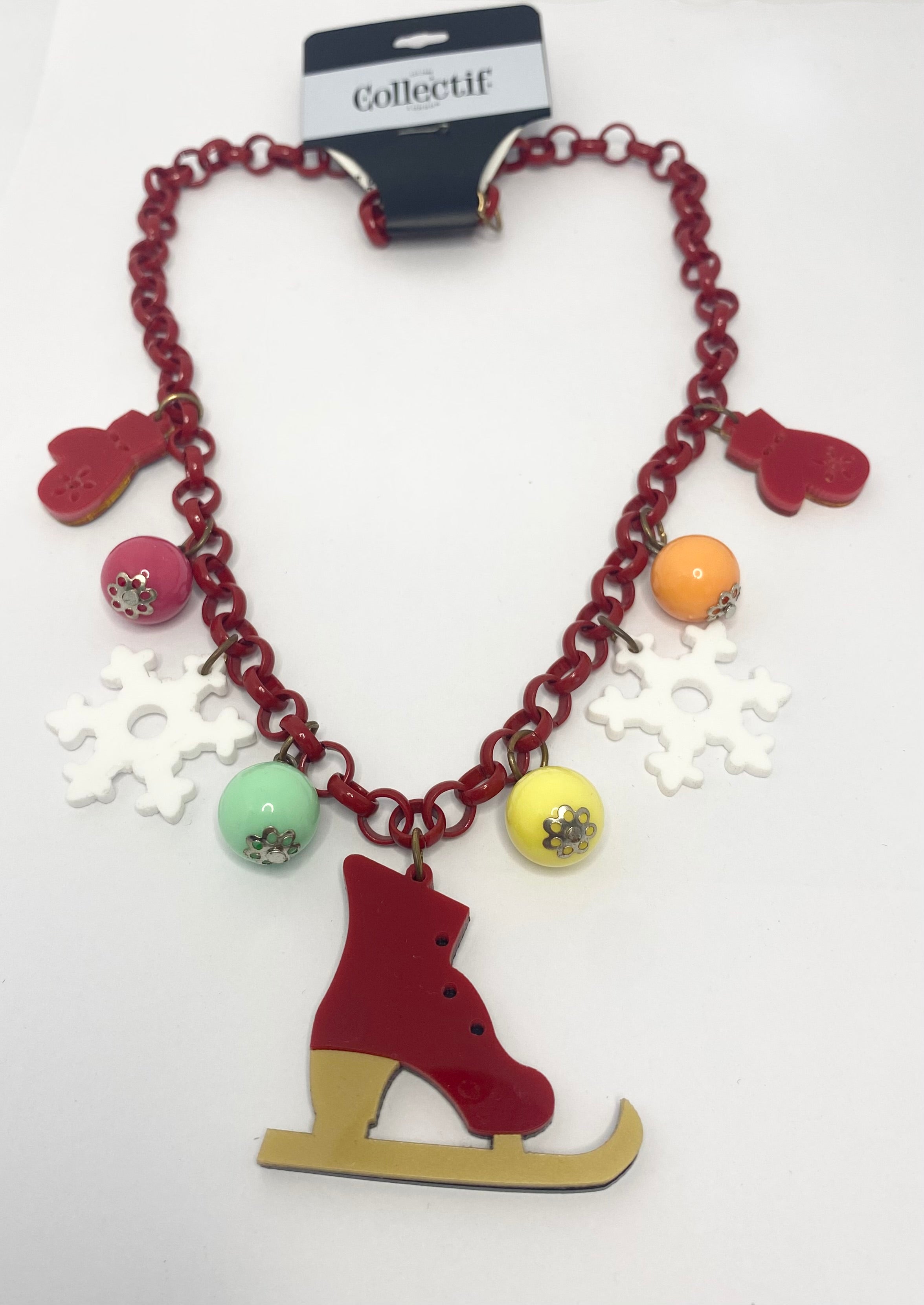 Seasonal Greetings Necklace with ice skate charm and colourful beads on a white background
