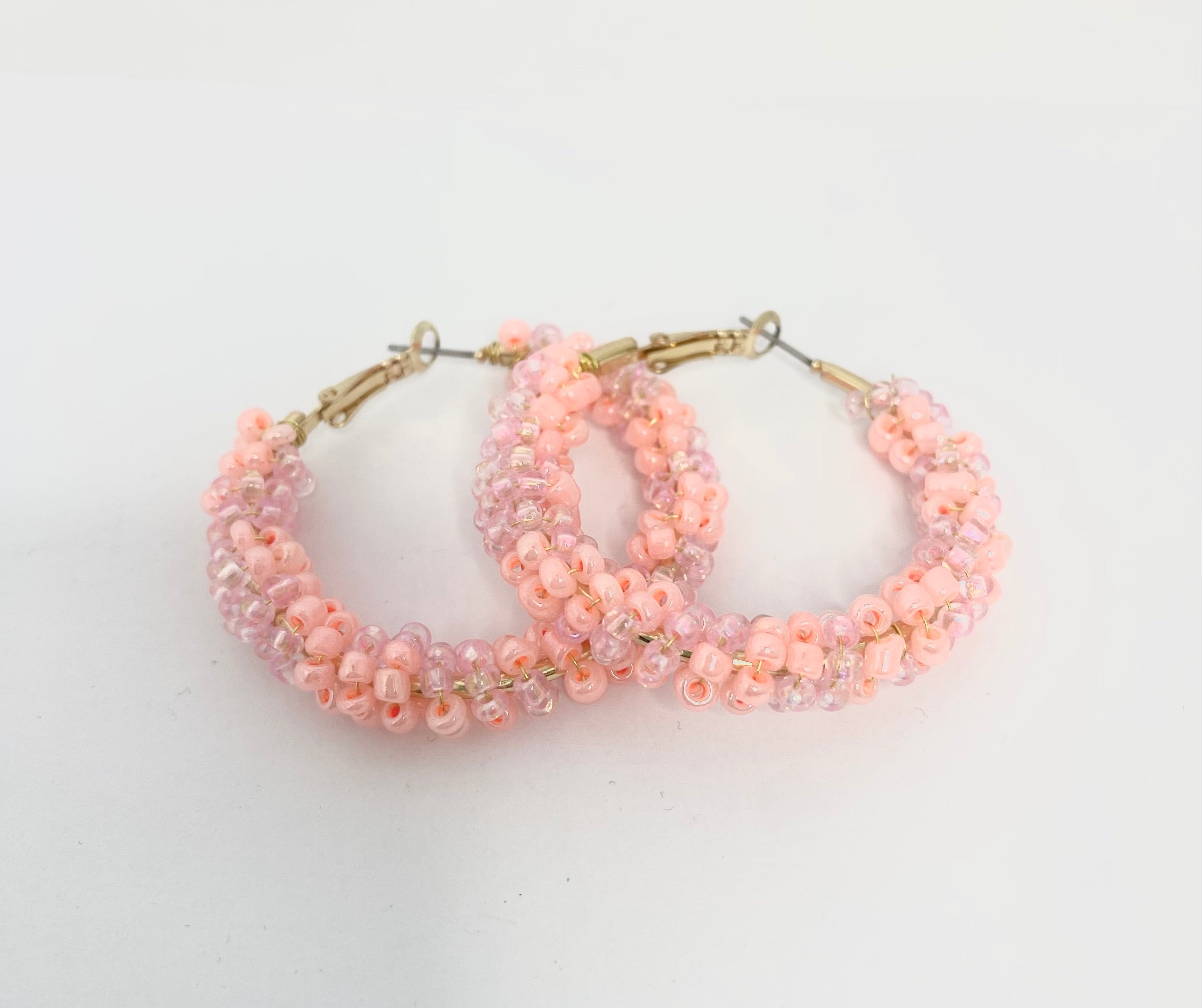 Sherbet peach and soft pink 1950s inspired beaded hoops.