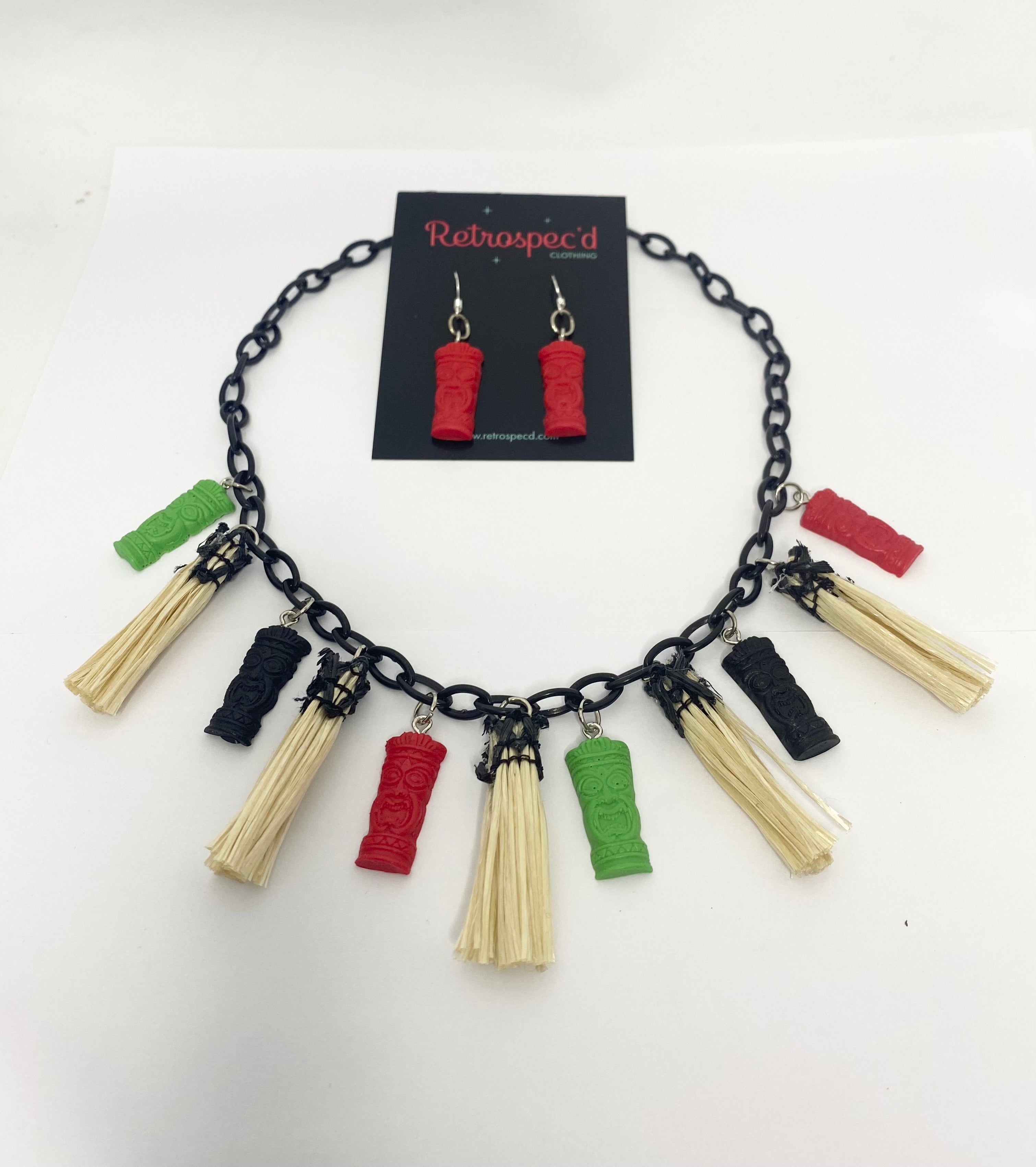 Tiki 1950s style Necklace with colourful tassel pendants on a white background