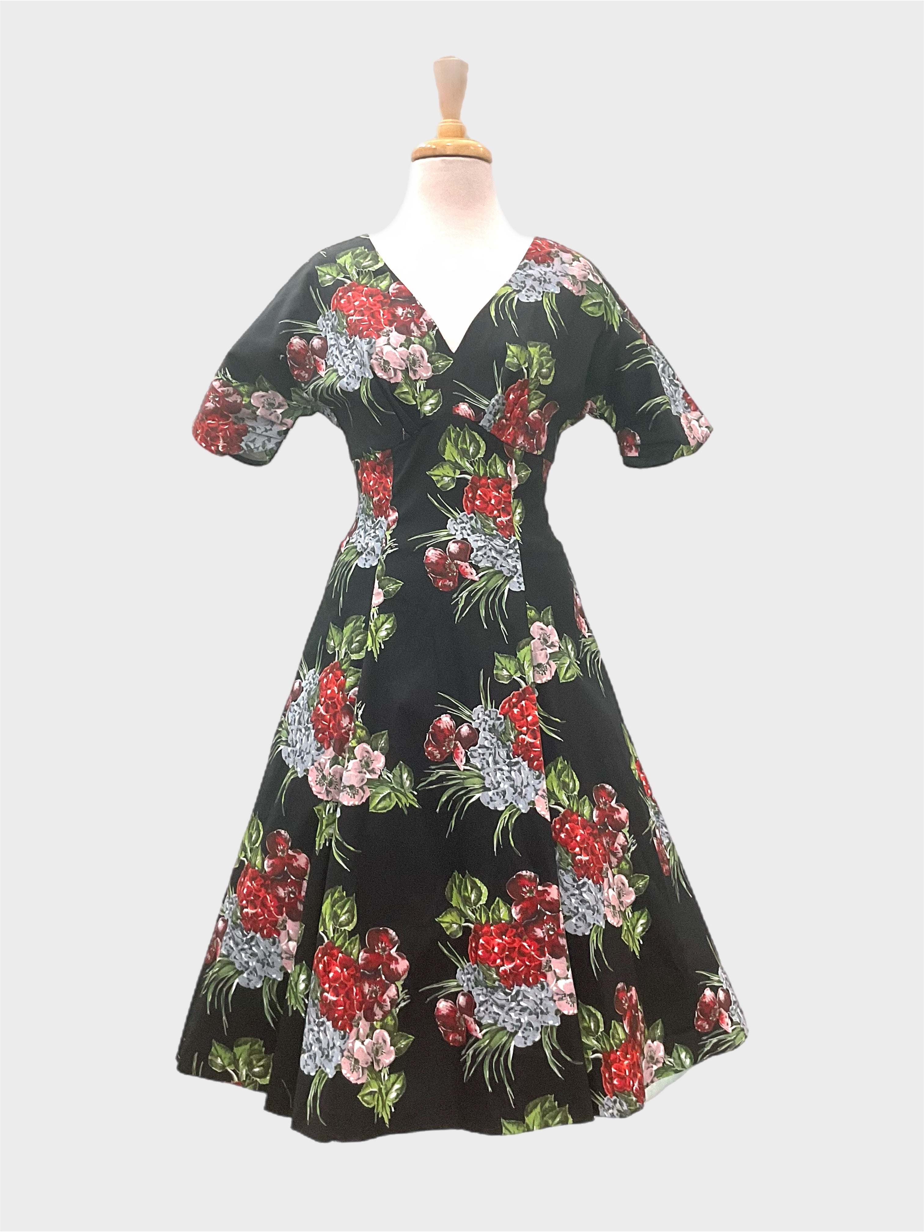 Wendy Milan vintage 1950s style dress with a sweetheart neckline, dolman sleeves, and  Black floral print in cotton stretch sateen